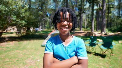 African American child at a campsite