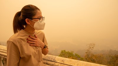 Asian woman having respiratory allergy caused of by Bad air pollution