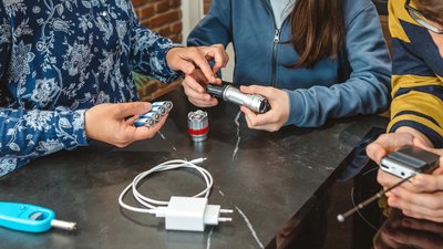 Banner of teenager checking emergency radio while mother teaching her daughter how to use battery power flashlight of 72 hours survival kit