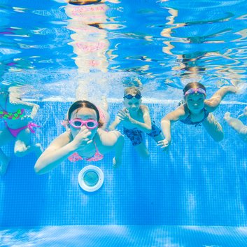 Children swim in pool