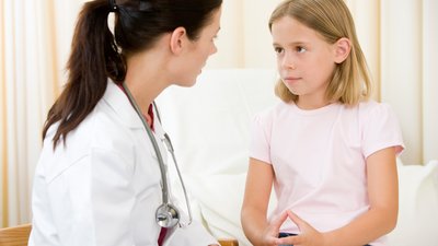 Doctor speaking with child