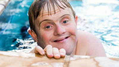 Portrait of handicapped boy in swimming pool