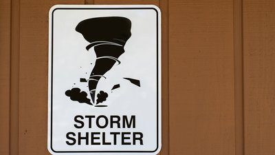 Storm shelter sign with tornado image
