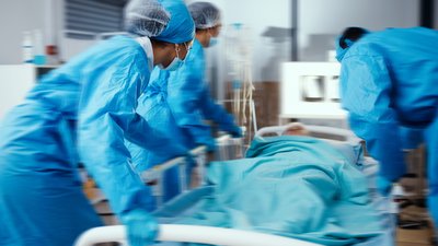 Women, man and hospital bed in motion blur of emergency surgery