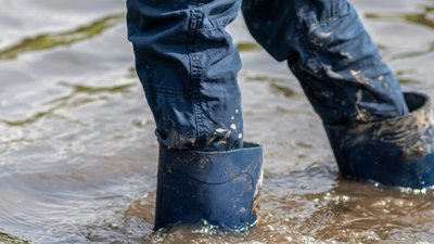 walking-with-boots-in-water