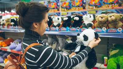 woman look for soft panda toy